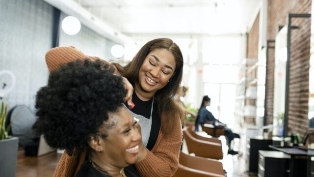 hairstylist-trimming-the-customer-39-s-hair-at-a-beauty-salon